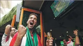  ?? Maria Alejandra Cardona Los Angeles Times ?? AMIR ARDALAN Razi celebrates Iran’s World Cup victory on Friday. Fans were anxious until the last minute, when a Morocco player’s own goal gave Iran the win.