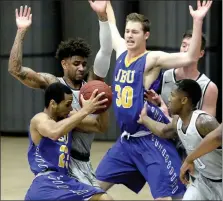  ?? Photo courtesy of Texas Wesleyan ?? John Brown senior Ricky Roberts drives into the lane against Texas Wesleyan on Saturday in Fort Worth, Texas. The Golden Eagles play at Science and Arts (Okla.) on Thursday before returning to Bill George Arena at 5 p.m. Saturday to face St. Gregory’s...