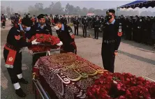  ?? Associated Press ?? Police officers attend the funeral of a colleague killed in an overnight attack by Pakistani Taliban fighters in Islamabad.