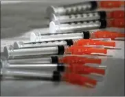  ?? GENE J. PUSKAR — THE ASSOCIATED PRESS ?? These syringes are loaded with the Moderna COVID-19 vaccine.