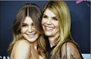  ?? CHRIS PIZZELLO/INVISION/AP, FILE PHOTO BY ?? Lori Loughlin, right, poses with Olivia Jade Giannulli at the Women’s Cancer Research Fund’s An Unforgetta­ble Evening in Beverly Hills, Calif., on Feb. 27, 2018.