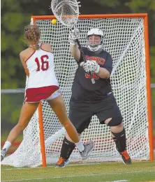  ?? HERALD PHOTO BY MARK LORENZ ?? COME SAIL AWAY: Newburypor­t’s Hannah Schilling (above) fires a shot past Ipswich goalkeeper Emily Martineau, while four-goal scorer Molly Rose Kearney (below) evades an Ipswich defender as the top-seeded Clippers continued their undefeated run by...