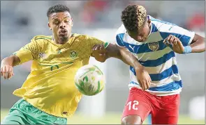  ?? (Pic: SuperSport) ?? Bafana Bafana’s Lyle Foster (L) being challenged by a Liberia player during their AFCON match at Orlando Stadium yesterday.