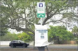  ?? JOHN RAOUX — THE ASSOCIATED PRESS ?? A parking area with charging stations for electric vehicles at a public park in Orlando, Fla., on Thursday.