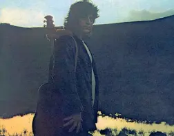  ??  ?? Con la sua chitarra Pino Daniele sulla copertina di «Nero a metà»