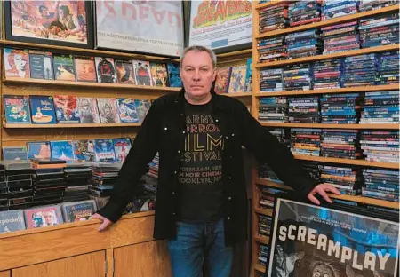  ?? ISAIAH WINTERS/THE NEW YORK TIMES ?? Will Malitek, founder and sole employee of Film Noir Cinema in Brooklyn, is seen June 4.