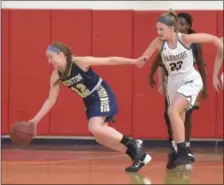  ??  ?? West Chester Rustin’s Oliva Gatto dribbles away from Henderson’s (23) Michaella Meredith in the first quarter Saturday.