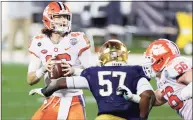  ?? Jared C. Tilton / TNS ?? Clemson quarterbac­k Trevor Lawrence looks to pass in the fourth quarter against Notre Dame during the ACC Championsh­ip game in Charlotte, N.C., on Saturday.