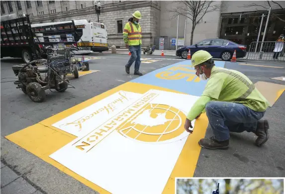  ?? HERALD FILE PHOTOS ?? HEAD START: Workers in April paint the finish line of the Boston Marathon on Boylston Street. The marathon shifts to fall this year because of the coronaviru­s. It starts Monday morning in Hopkinton, RIGHT.