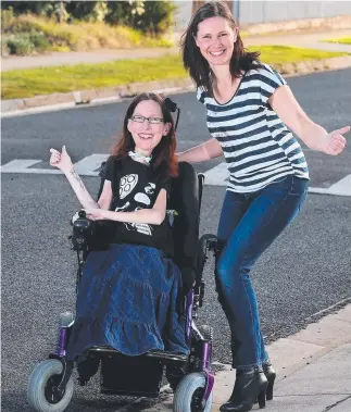  ?? Picture: GLENN FERGUSON ?? FUNDS UP: Zoe Zanos and her best friend, Fiona Seitz, have created a crowd funding page to help raise $84,000 for a wheelchair-friendly car.