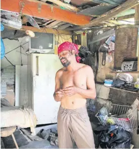  ?? NATHANIEL STEWART PHOTOS ?? Omar Samuda, known to everyone as Red Rat, inside the shack that he built along the banks of the river in Frankfield, Clarendon.