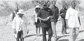  ??  ?? Permanent Secretary in the Ministry of Informatio­n, Media and Broadcasti­ng Services, Mr George Charamba (right), with Broadcasti­ng Authority of Zimbabwe (BAZ) and ZimDigital officials tour the condemned site in Zvishavane