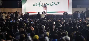  ?? — AFP photos ?? This photograph shows Syed Mustafa Kamal (centre), senior deputy convener of the Muttahida Qaumi MovementPa­kistan (MQM-P) party addressing supporters gathered during a meeting after the release of national election results, outside the party office in Karachi.