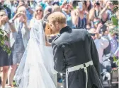  ?? Picture: Reuters ?? NEW BLOOD. Meghan and Prince Harry kiss after their wedding.