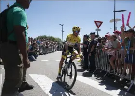  ?? THIBAULT CAMUS - THE ASSOCIATED PRESS ?? France’s Julian Alaphilipp­e wearing the overall leader’s yellow jerse arrives for the start of the fifth stage of the Tour de France cycling race over 175.5 kilometers (109 miles) with start in Saint-Die-Des-Vosges and finish in Colmar, Wednesday, July 10, 2019.