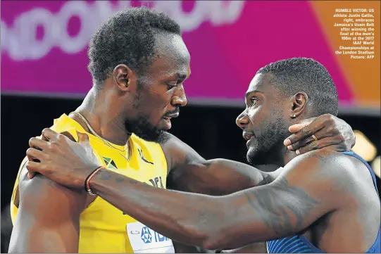  ??  ?? HUMBLE VICTOR: US athlete Justin Gatlin, right, embraces Jamaica’s Usain Bolt after winning the final of the men's 100m at the 2017 IAAF World Championsh­ips at the London Stadium Picture: AFP