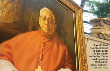  ?? ALDO NELBERT
BANAYNAL ?? A portrait of Cardinal Vidal is displayed at his wake inside the Cebu Metropolit­an
Cathedral.