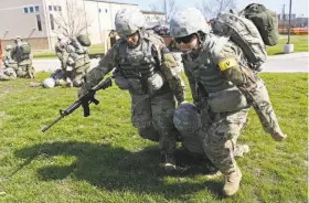  ?? Jerry Lara / San Antonio Express-News ?? Female Army medics train at Fort Sam Houston in San Antonio. Female officers are being integrated into infantry and armor brigades at 3 more bases.