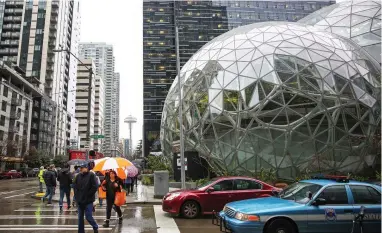  ?? PICTURE: REUTERS ?? LANDSCAPE OF THE FUTURE: The Amazon Spheres on Lenora Street in Seattle, Washington,with the Space Needle in the background.