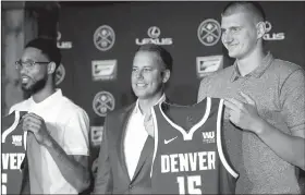  ?? AP/DAVID ZALUBOWSKI ?? Denver Nuggets center Nikola Jokic (right) joins guard Will Barton (left) and Josh Kroenke, president of the Denver Nuggets, during a news conference Monday to outline a contract extension for Jokic and the re-signing of Barton.