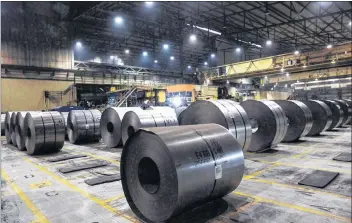  ?? CP PHOTO ?? Rolls of coiled steel are seen at Canadian steel producer Dofasco in Hamilton Ont., Tuesday, March 13, 2018. A Canadian source close to the ongoing talks to resolve U.S. tariffs on steel and aluminum is insisting Canada is not about to agree to quotas or other limits on its exports in order to get the levies lifted.