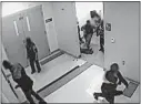  ?? [CINCINNATI PUBLIC SCHOOLS VIA AP] ?? In this still image from a Jan. 24 surveillan­ce video, the legs and feet of 8-year-old Gabriel Taye can be seen as he lies on the floor of a boys’ bathroom after he reportedly was knocked unconsciou­s by another boy at Carson Elementary School. Two days...