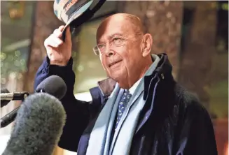  ?? EVAN VUCCI, AP ?? Billionair­e investor Wilbur Ross, tapped as the next Commerce secretary, speaks to the media Tuesday at Trump Tower in New York City. Ross has been called “the king of bankruptcy.”