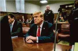  ?? Getty Images ?? Former President Donald Trump appears in court for his trial for allegedly covering up hush money payments at Manhattan Criminal Court on Tuesday in New York City. Trump faces 34 felony counts of falsifying business records in the first of his criminal cases to go to trial.