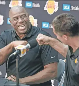  ?? Wally Skalij Los Angeles Times ?? SOME READERS support Magic Johnson, left, who scolded Lakers coach Luke Walton. Others hope he didn’t offer advice from his days as Lakers coach in 1994.