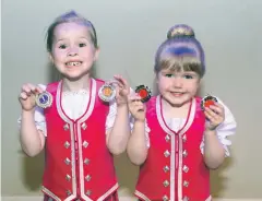  ??  ?? Young dancers from a previous festival showing off their medals.