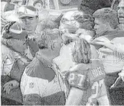  ?? ESPN ?? Buddy Ryan, left, and Kevin Gilbride, right, are separated after their infamous sideline confrontat­ion on Jan. 2, 1994.