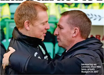  ??  ?? Measuring up: Lennon, then Hibs boss, greets Rodgers in 2017