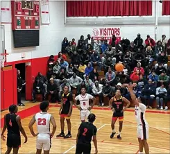  ?? L.A. PARKER/ TRENTONIAN PHOTO ?? Fans watched Trenton High boys basketball team defeat St. Thomas Aquinas in Edison on Monday.