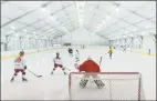  ?? Erik Trautmann / Hearst Connecticu­t Media ?? The New Canaan High School girls hockey team practices at The Rinks at Veterans Park in Norwalk in February 2017. The Rinks were closed Monday, apparently the second such closure related to high winds.