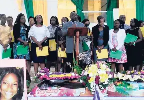  ??  ?? Michael Ellis (at podium), principal of Green Pond High School in Montego Bay, presents a tribute during the funeral for slain 15-year-old Green Pond High student Shineka Gray, at the King’s Seventh-day Adventist Church in Mount Salem, Montego Bay,...