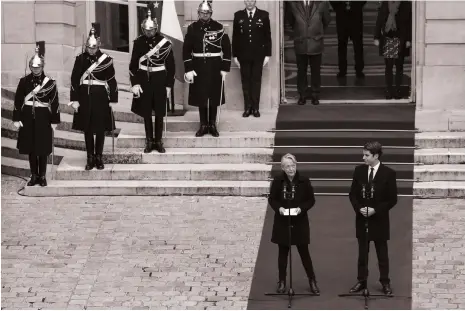  ?? EPA ?? Departing French prime minister Elisabeth Borne hands over to her successor Gabriel Attal at a ceremony in Paris this week