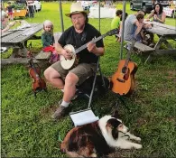  ?? DANA JENSEN THE DAY ?? Craig Edwards of Mystic performs with his dog, Tucker, at the Denison Farmers Market last summer.