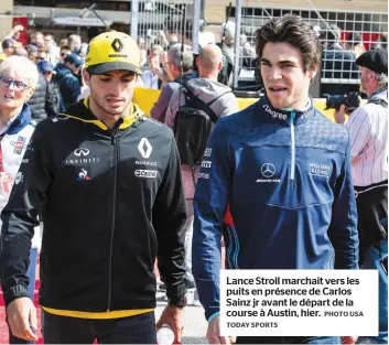  ?? TODAY SPORTS PHOTO USA ?? Lance Stroll marchait vers les puits en présence de Carlos Sainz jr avant le départ de la course à Austin, hier.