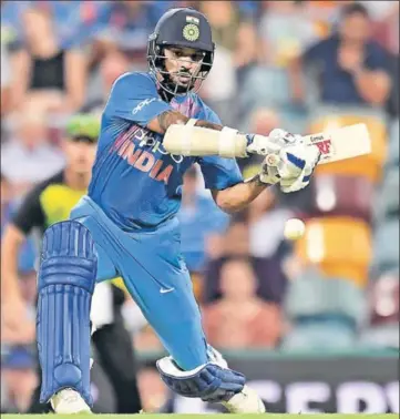  ?? GETTY ?? Shikhar Dhawan’s 42ball 76 kept India in the hunt after being set a target of 174 in 17 overs in the rainhit first T20 in Brisbane.