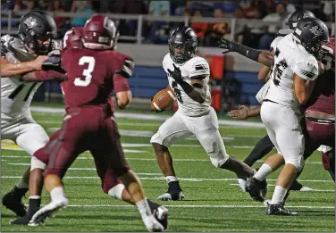  ?? Terrance Armstard/News-Times ?? Looking for daylight: Smackover’s Greg Turner (6) looks for an opening in Foreman’s defense during first half action at Wilkins Stadium in Magnolia Monday. Turner scored five touchdowns to lead Smackover to a 45-24 win.