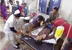  ?? — AFP ?? A patient who drank toxic bootleg liquor is treated at Kushal Konwar Civil Hospital in Golaghat district in Assam on Saturday.