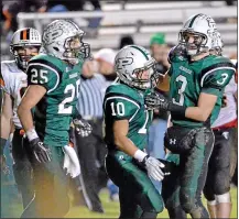  ?? MEDIANEWS GROUP FILE PHOTO ?? Pennridge’s John Kim (10) is congratult­ated by teammates Micah Stutzman (3) and Mike Class (25) after his touchdown against Pennsbury during first-half action of their playoff contest at Poppy Yoder Field on Nov. 16, 2012.