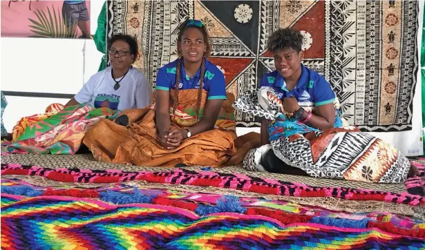  ?? Photo: Sereana Salalo ?? Rooster Chicken Fijiana Drua players, Doreen Narokete (second from left) and Vitalina Naikore (right) during their joint celebratio­n at Milverton Road, Raiwaqa, on May 13, 2022. They were accorded a traditiona­l welcome ceremony and church service hosted by the Narokete family.