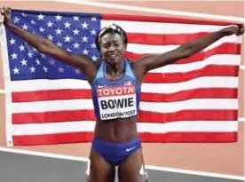  ??  ?? LONDON: United States’ Tori Bowie celebrates after winning the gold medal in the Women’s 100 meters final during the World Athletics Championsh­ips in London Sunday. — AP