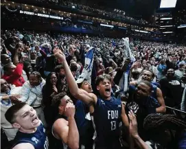  ?? Dylan Buell/TNS ?? Jo’el Emanuel (13) of Fairleigh Dickinson celebrates with the crowd after beating Purdue 63-58 in the first round of the NCAA Tournament at Nationwide Arena on Friday in Columbus, Ohio.