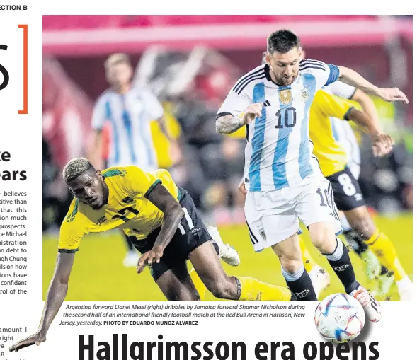  ?? PHOTO BY EDUARDO MUNOZ ALVAREZ ?? Argentina forward Lionel Messi (right) dribbles by Jamaica forward Shamar Nicholson during the second half of an internatio­nal friendly football match at the Red Bull Arena in Harrison, New Jersey, yesterday.