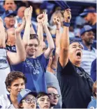  ??  ?? Memphis fans celebrate during the game against Georgia State on Friday night. MARK WEBER / THE COMMERCIAL APPEAL