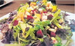  ?? AMY DREW THOMPSON/ORLANDO SENTINEL ?? As with many Southern restaurant­s, MJPs menu — much of it — will inspire naps and meat sweats. Not so of the massive Farmhouse Salad: colorful, fresh, mercifully light.