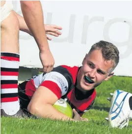  ??  ?? Smiles Winger Charlie Dineen is delighted with his try. Photo by Bryan Robertson