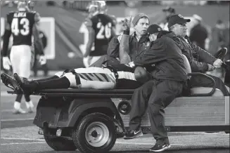  ?? The Associated Press ?? Cincinnati Bengals outside linebacker Vontaze Burfict gestures as he is carted off the field after an apparent injury in the second half of an NFL football game against the Pittsburgh Steelers on Monday.